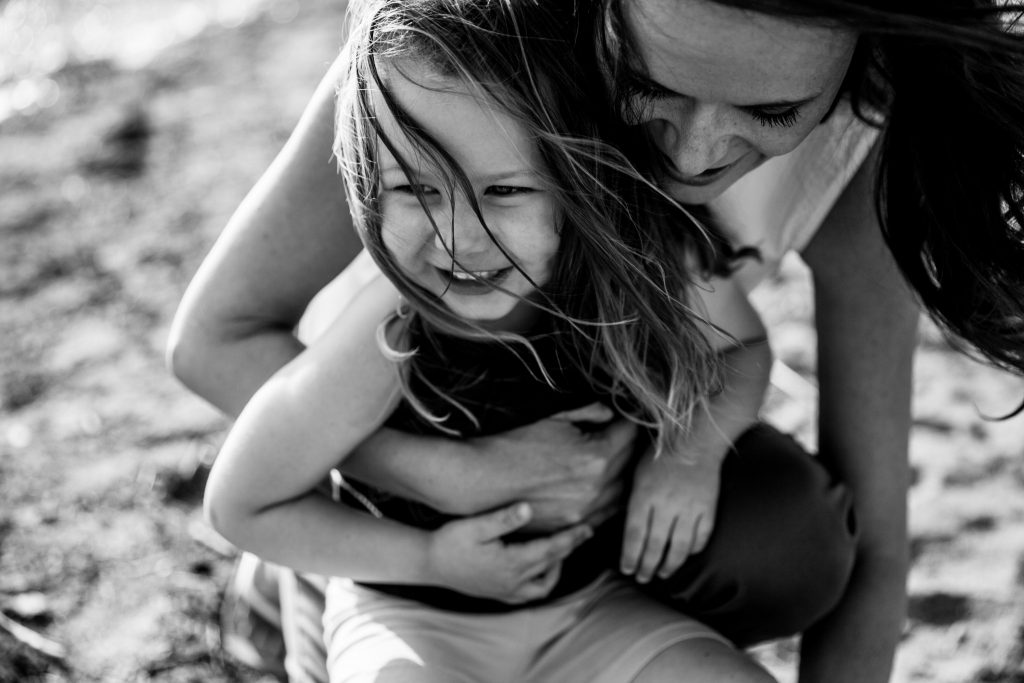 Victoria BC Family Photographer | mother and daughter at the beach in the wind