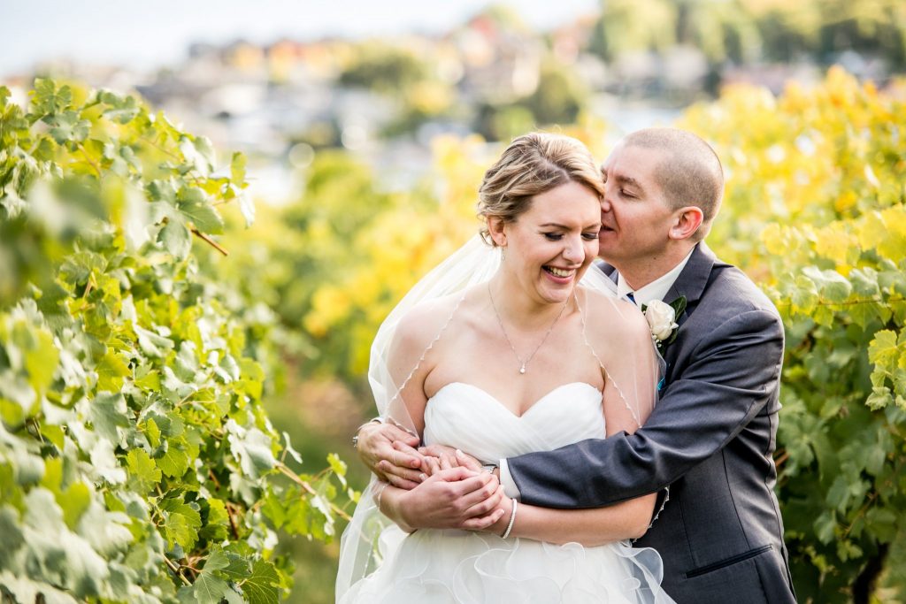 Stellavate Photography | Victoria BC wedding Photographer | Bride and groom embracing in a vineyard