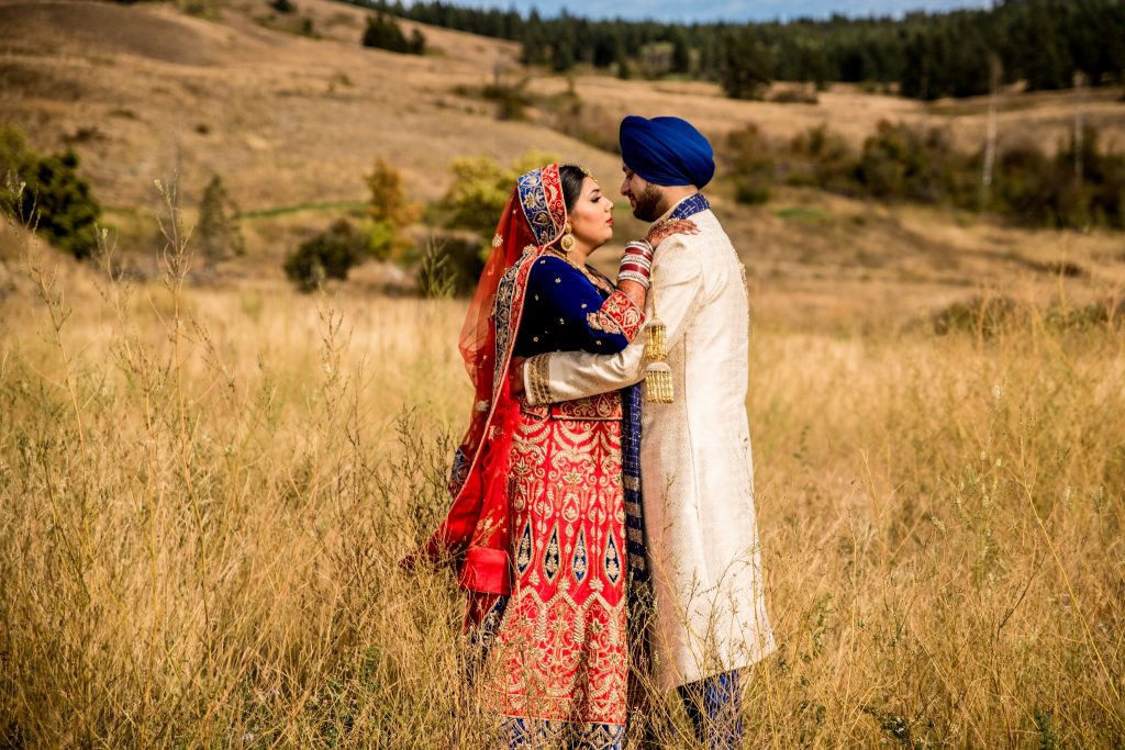 Stellavate Photography | Victoria BC wedding Photographer | Indian wedding couple embrace in a field