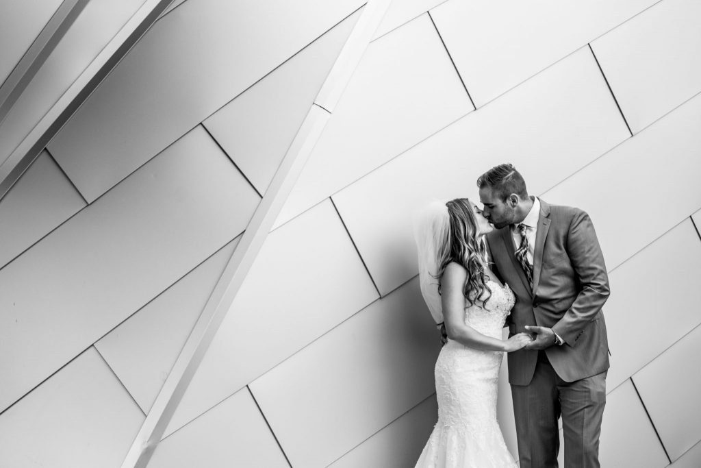 Stellavate Photography | Victoria BC wedding Photographer | Bride and groom kiss in front of sparkling hill