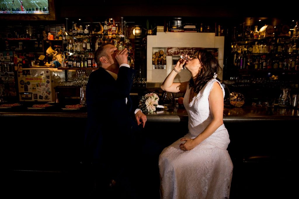 Stellavate Photography | Victoria BC wedding Photographer | bride and groom taking shots at the bar wedding day