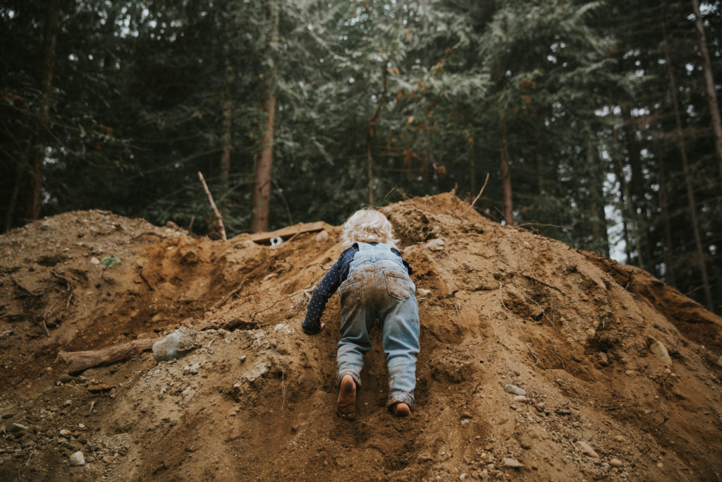 Victoria BC Family Photographer | toddler climbing dirt pile westwood lake