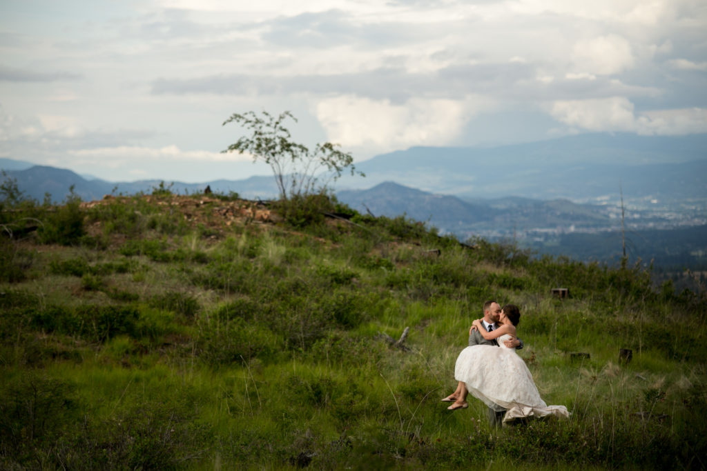 Stellavate Photography | Victoria BC wedding Photographer | Groom carries bride on a mountaintop