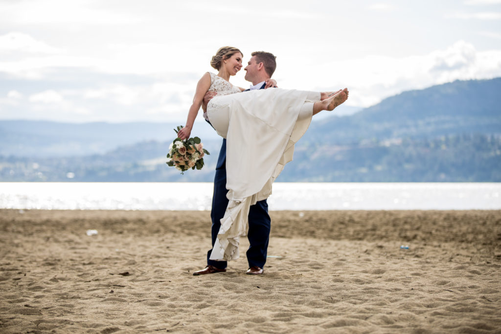 Stellavate Photography | Victoria BC wedding Photographer | Groom carries bride at the beach in the sand
