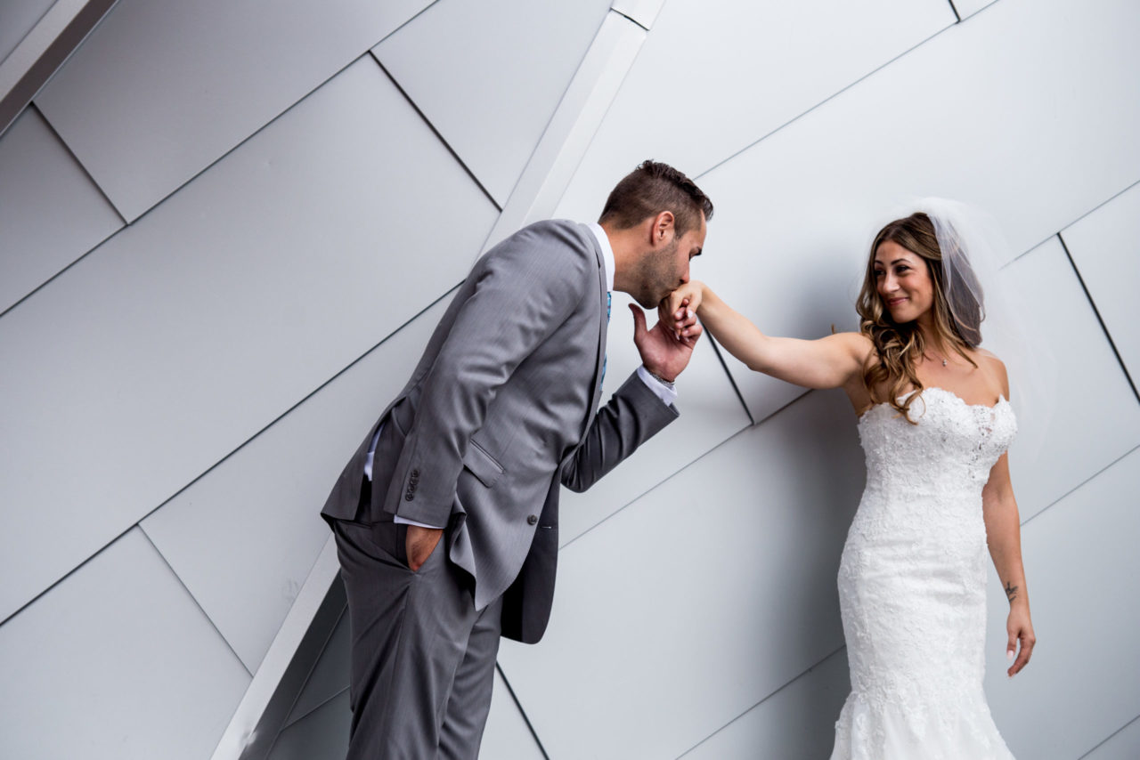 Stellavate Photography | Victoria BC wedding Photographer | Groom kissing bride's hand outside sparkling hill resort