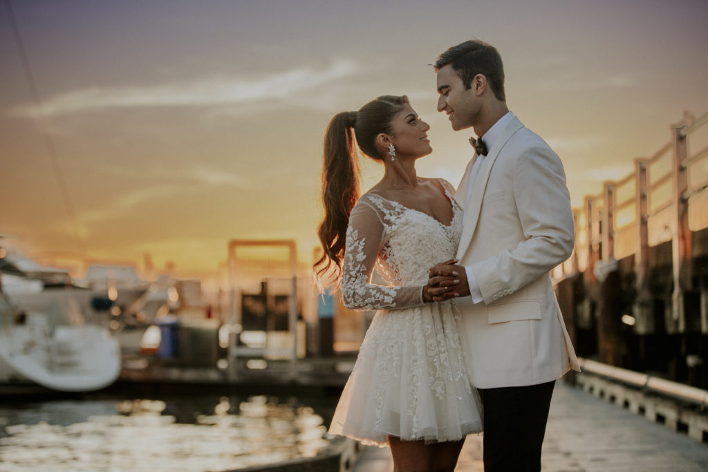 Stellavate Photography | Victoria BC wedding Photographer | Bride and groom standing in inner harbour at sunset, indian wedding